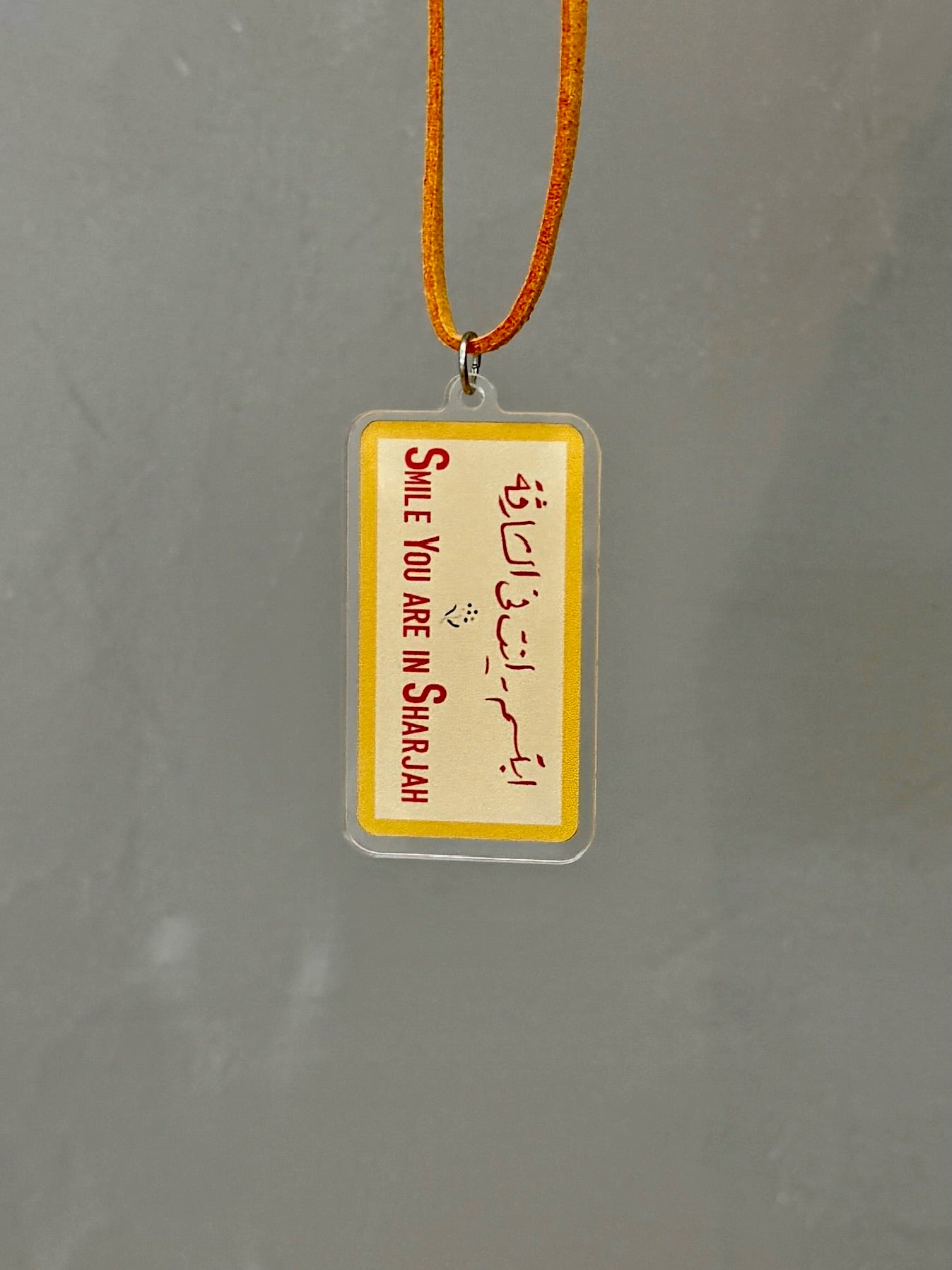Smile You’re In Sharjah Hanging Charm